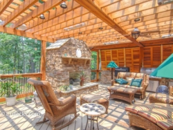 Outdoor fireplace on a Trex deck fireplace on a deck