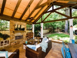 Stone fireplace on covered patio. covered patio