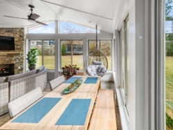 Sun room with patio, and furniture.